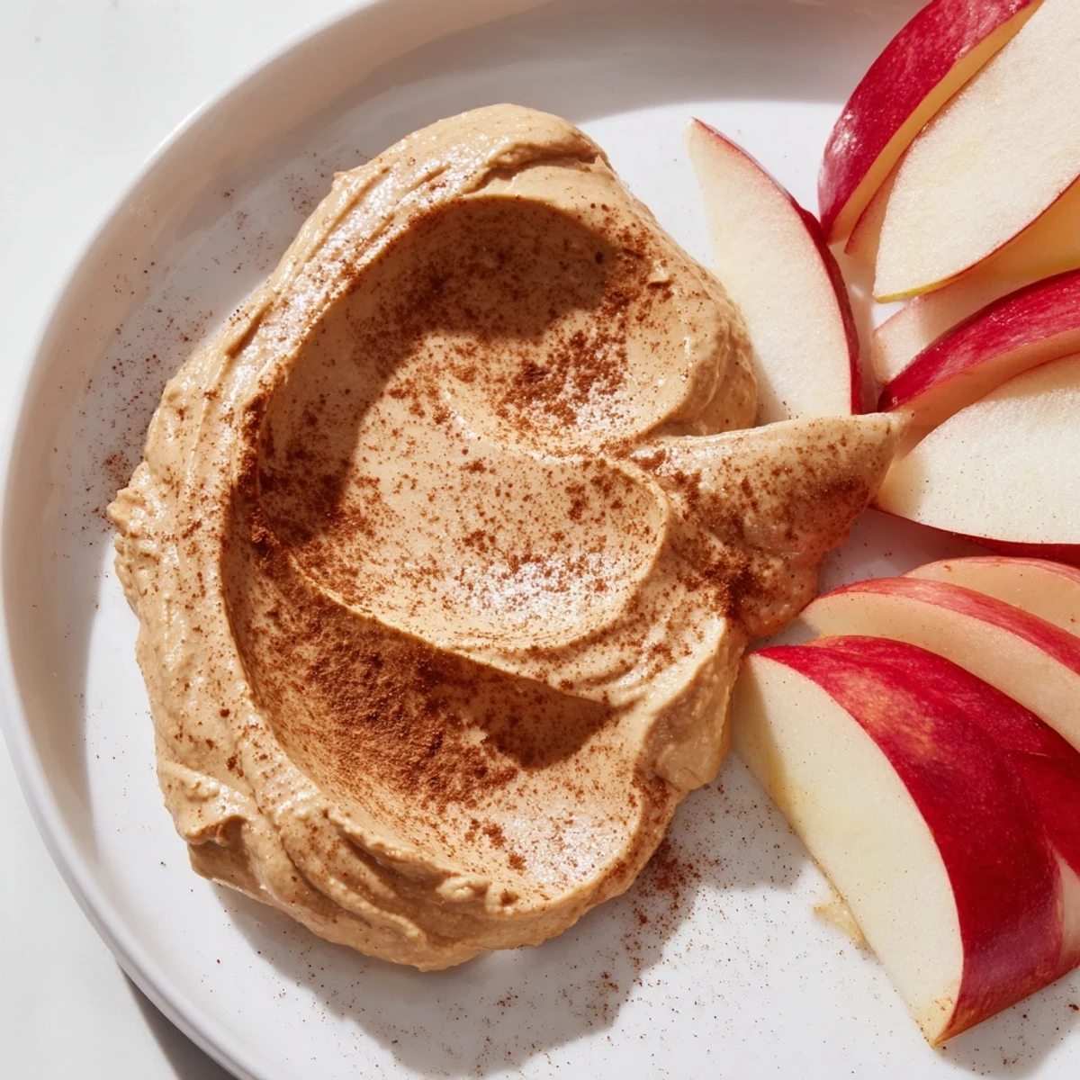 Cool, crunchy apple slices ideal with peanut butter dip, ready for a simple, satisfying treat.