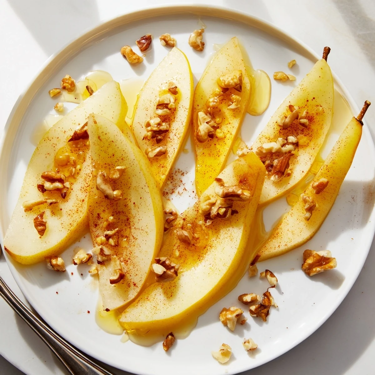 Freshly sliced pears with honey drizzle, a simple way to enjoy this sweet treat.