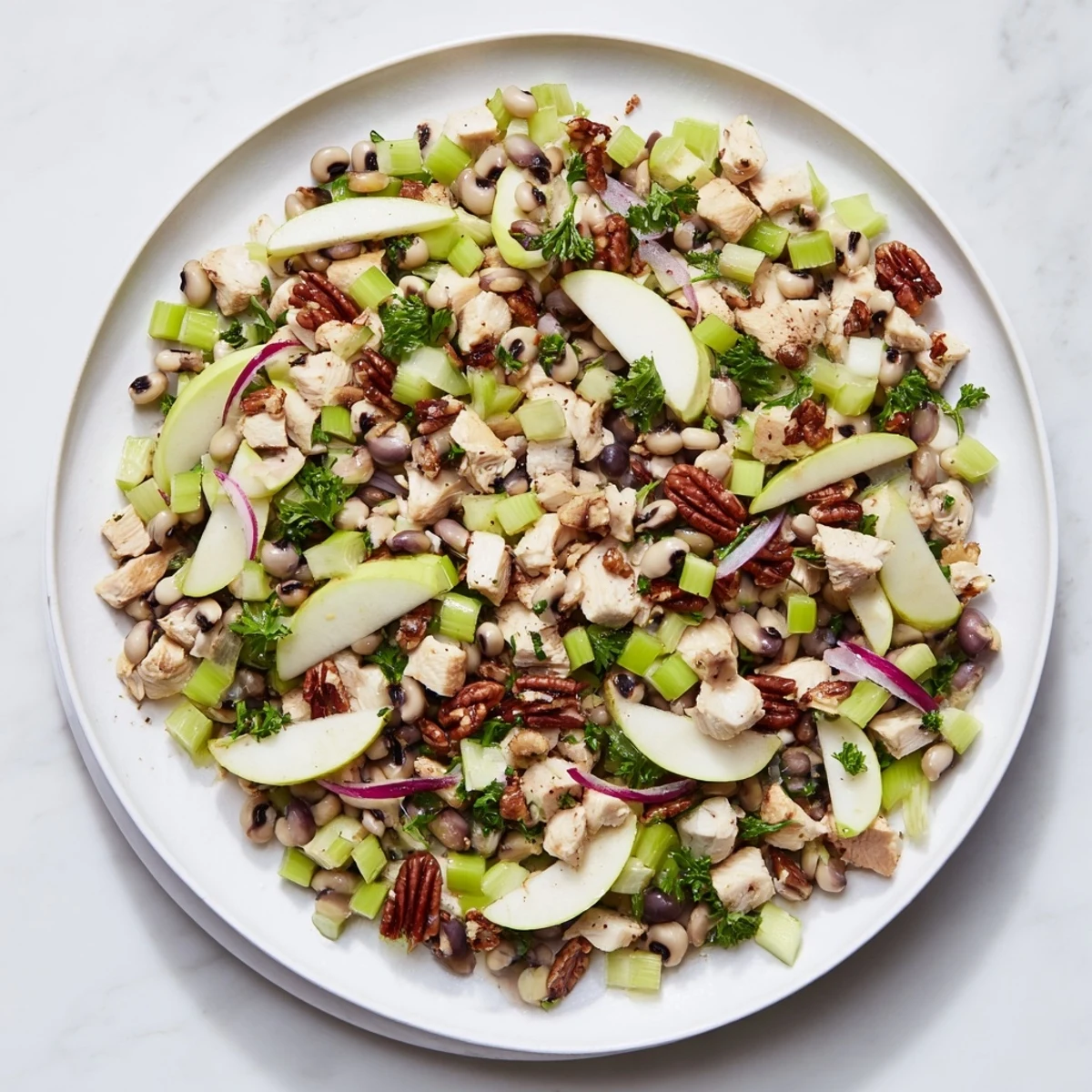 Chicken and Apple New Years Luck Salad, tossed with a creamy dressing, presents a vibrant, flavorful dish.