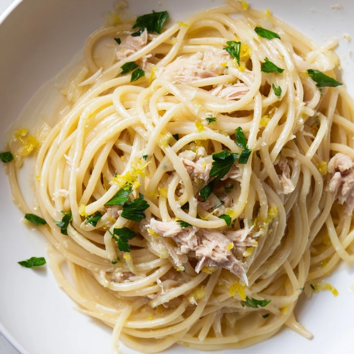 Golden strands of spaghetti with tender Lemon-Garlic Tuna, brightened by lemon and parsley.