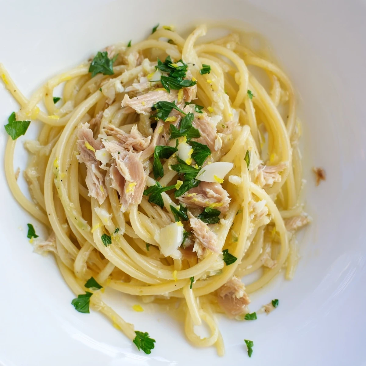 Close-up of freshly plated Lemon-Garlic Tuna Spaghetti, a quick weeknight dinner bursting with flavor.