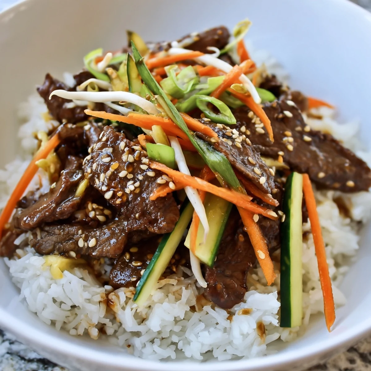 Savory Bulgogi Beef Bowl with glistening, caramelized beef and colorful, crisp vegetables, ready to eat.