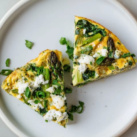 A beautiful, freshly baked Meadow-Soft Cozy Plate: Frittata topped with crumbled creamy goat cheese.