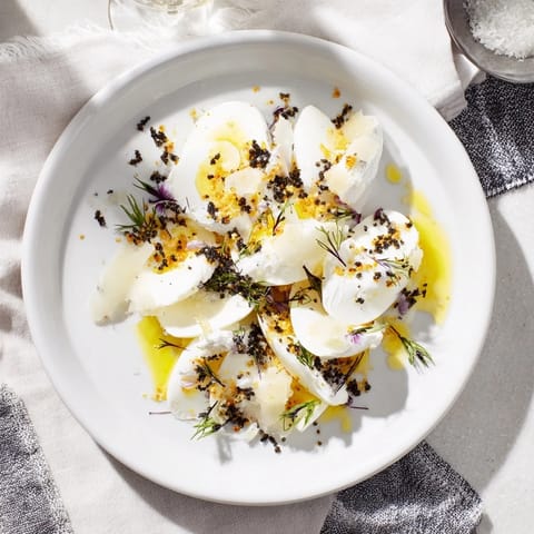 Exquisite The Silver Birch recipe with shaved Comté and truffle showcases a stunning vegetarian starter.