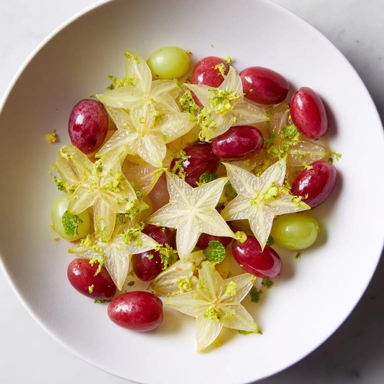 Brunch fruit garnish: Beautifully sliced starfruit and grapes, a sweet and simple delight.