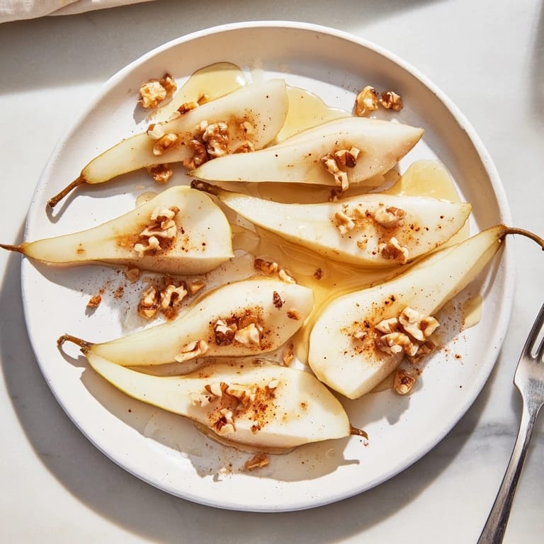 Golden honey glistening over juicy pear slices, a delightful snack sensation.