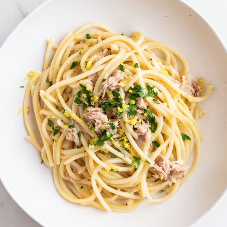Flaky tuna is tossed with garlic and lemon in this flavorful Lemon-Garlic Tuna Spaghetti.