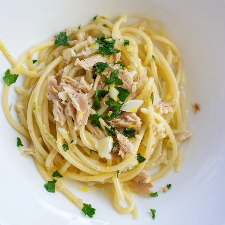 Close-up of freshly plated Lemon-Garlic Tuna Spaghetti, a quick weeknight dinner bursting with flavor.