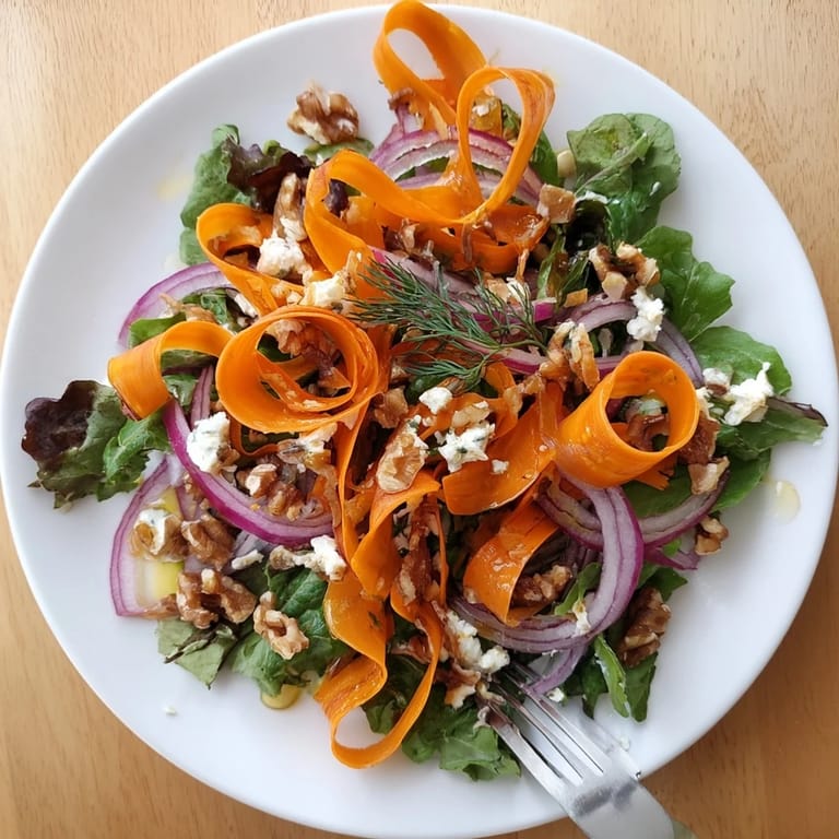 Vibrant Roasted Carrot Ribbon Salad with crisp vegetables and a bright, tangy dressing.