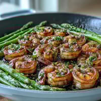 Healthy Easy One-Pan Lemon Garlic Shrimp and Asparagus with a bright citrus sauce and tender vegetables.